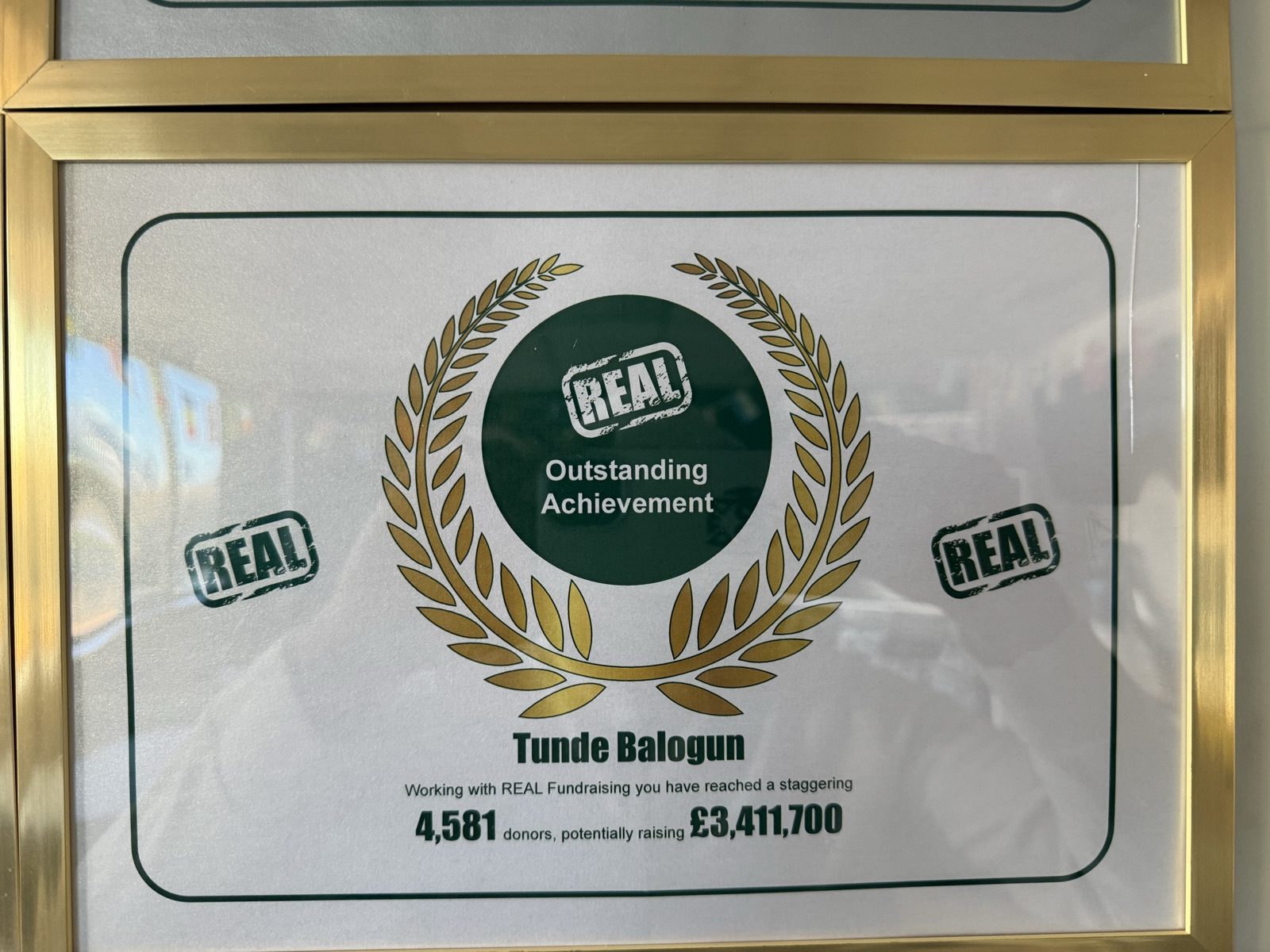 Real Fundraising 'Outstanding Achievement' plaque awarded to Tunde Balogun for reaching 4,581 donors and potentially raising £3,411,700.