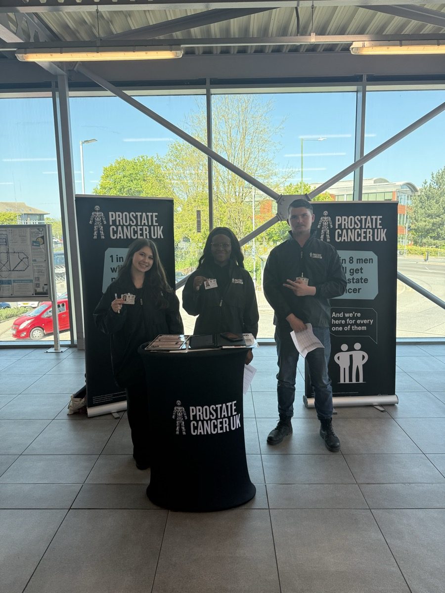 Three CKT brand ambassadors at a Prostate Cancer UK fundraising stand.